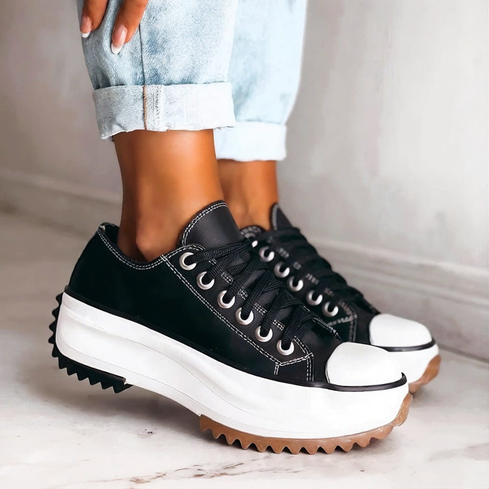 Carlotta black platform lace-up sneakers, side view on model