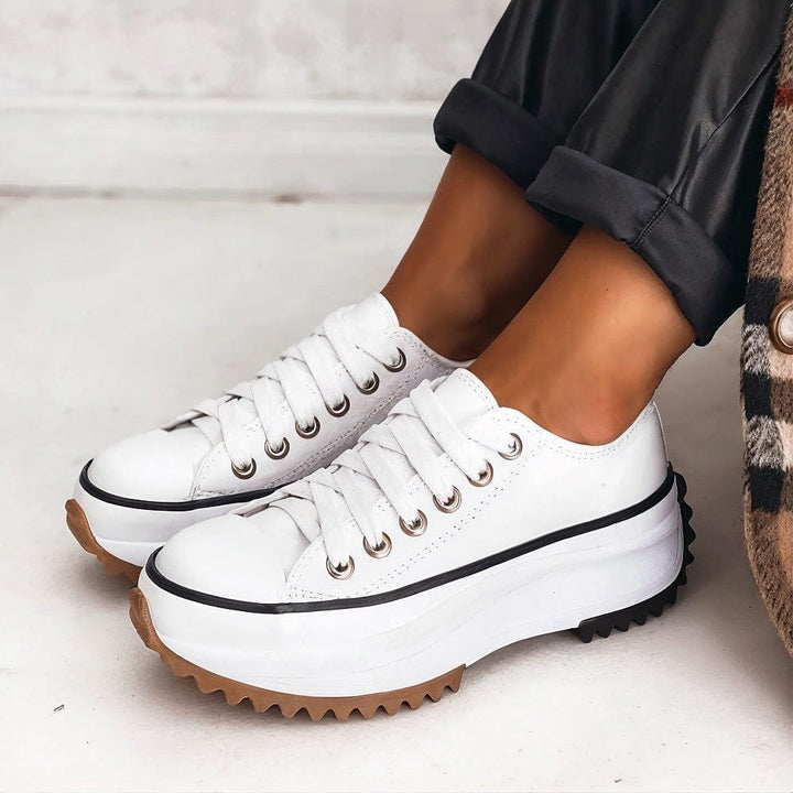 Carlotta white platform lace-up sneakers, side view on model