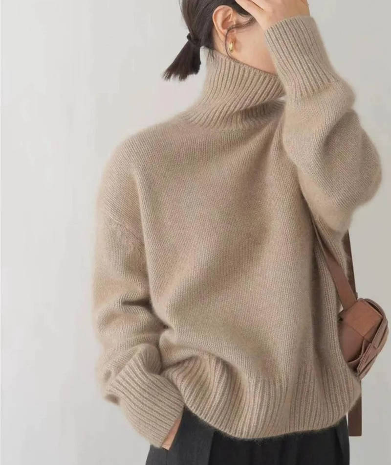Rosalind turtleneck sweater, side view with hand raised