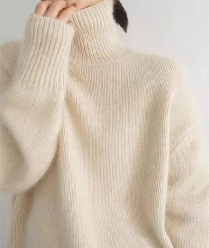 Rosalind turtleneck sweater in cream, side view with tote bag