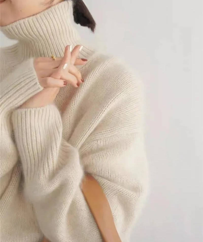 Rosalind turtleneck sweater in cream, side view with tote bag