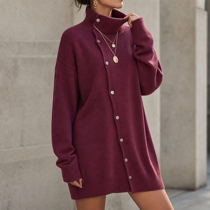 Marigold oversized turtleneck sweater dress, close-up front view with layered necklace