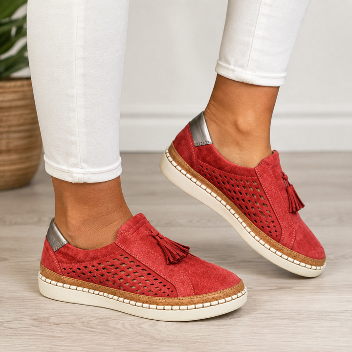 Isadora perforated tassel slip-on loafers in red, close-up side view