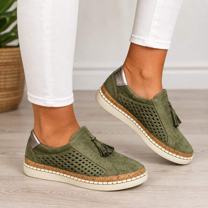 Isadora perforated tassel slip-on loafers in green, close-up side view