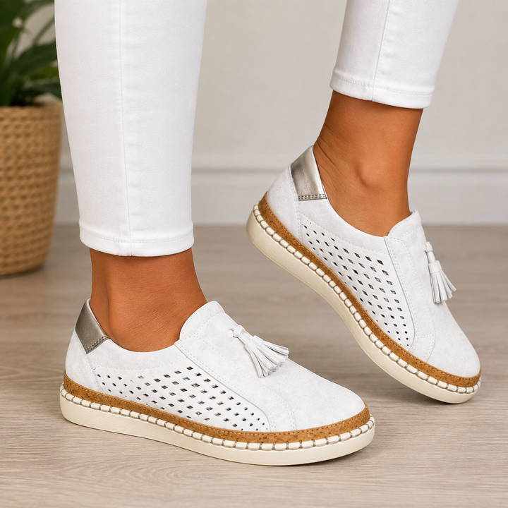 Isadora perforated tassel slip-on loafers in green, close-up side view