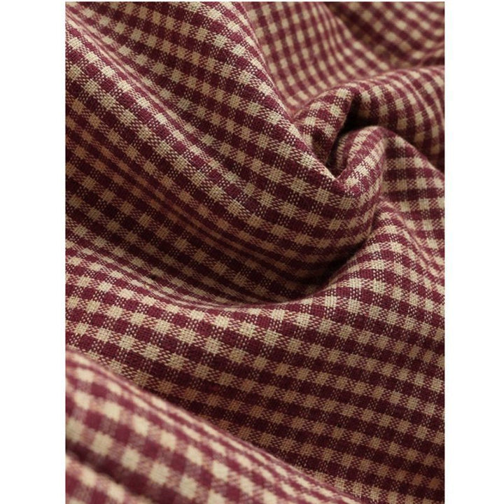 Close-up of Esmeralda coat plaid pattern fabric texture