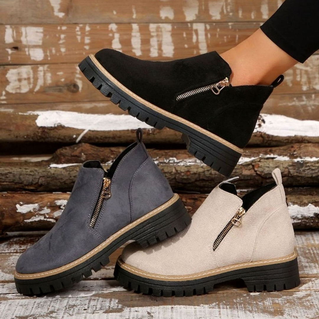 Black, gray and beige platform ankle boots with side zipper, styled shot