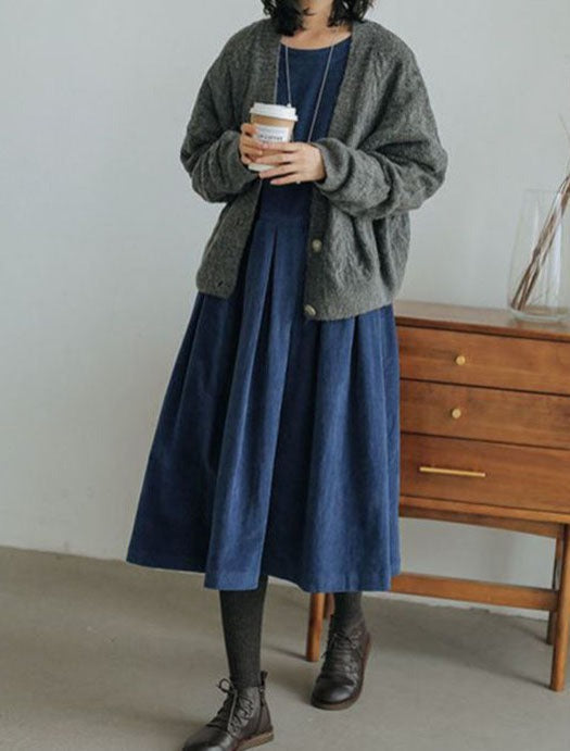 Odessa pleated midi dress in blue, styled with cardigan