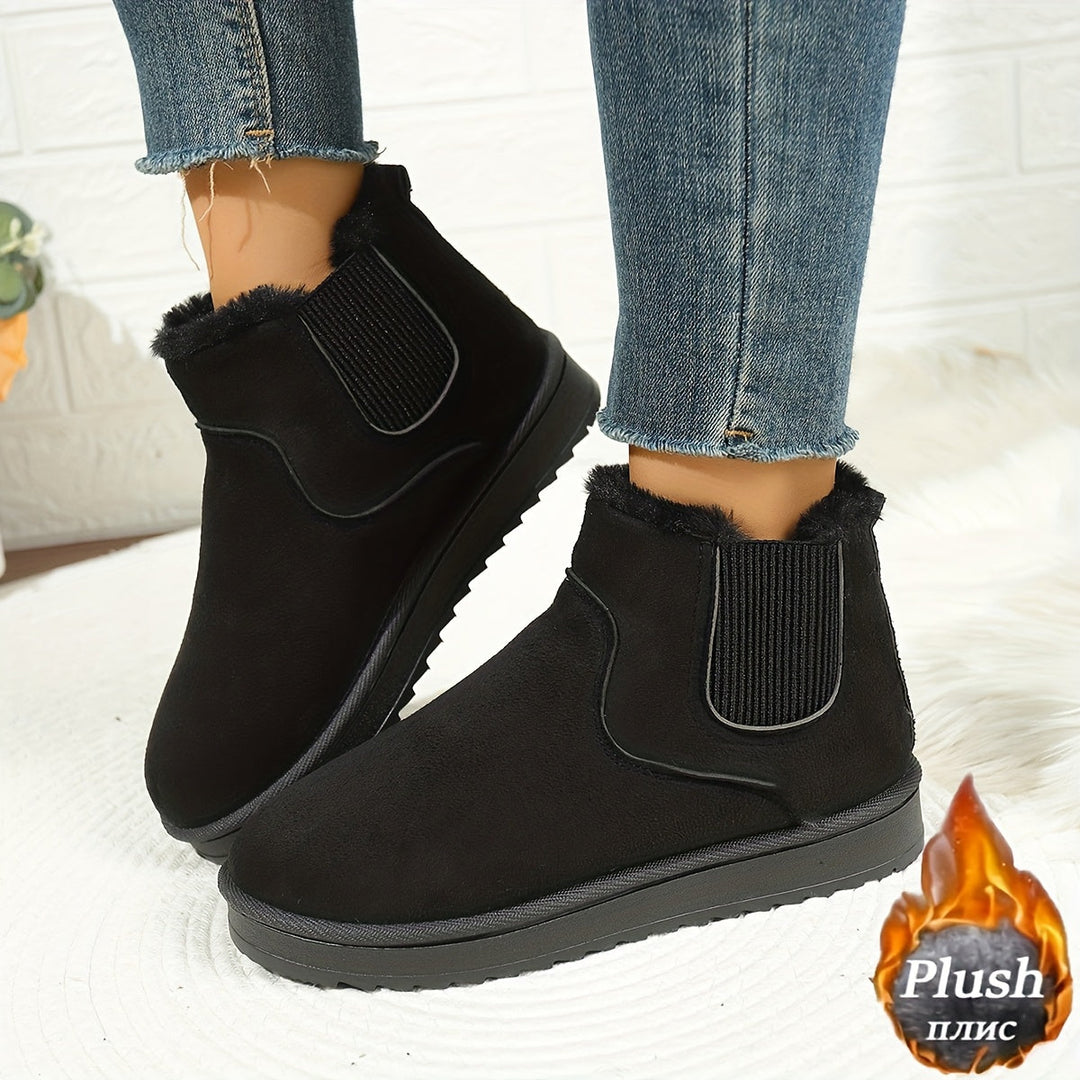 Odette black plush platform ankle boots, side view on model