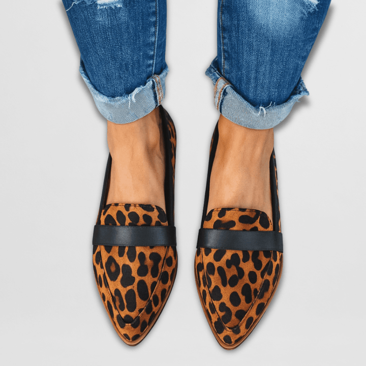 Rosalind leopard print pointed toe slip-on loafers worn with cuffed jeans, front view