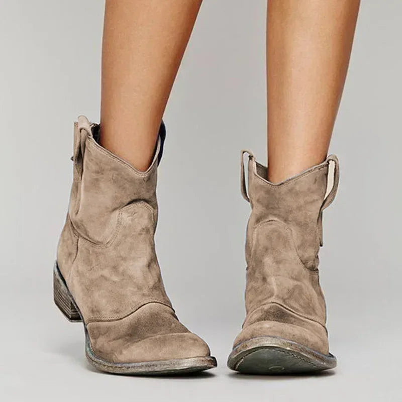Dashiell pointed toe cowboy boots in tan, front view on model