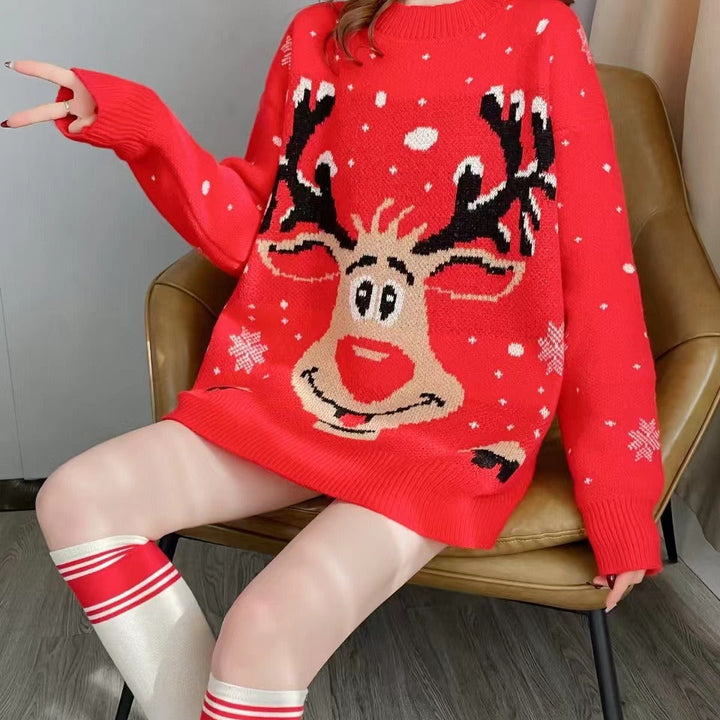 Clementine reindeer Christmas sweater styled with knee-high socks, seated view