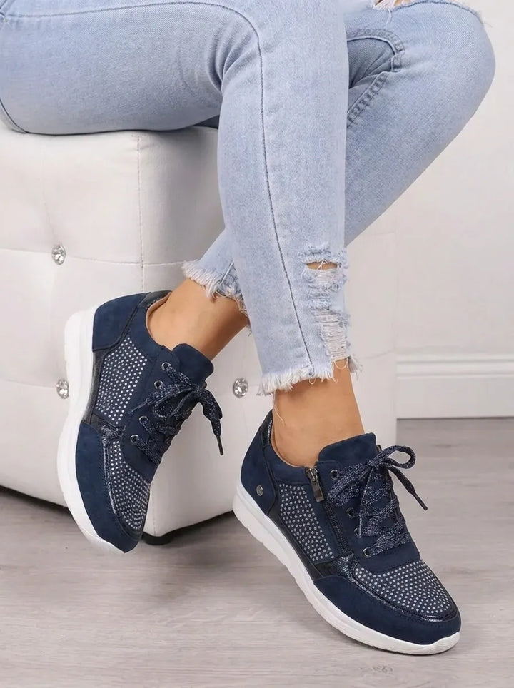 Veronique rhinestone lace-up sneakers, seated cross-leg view
