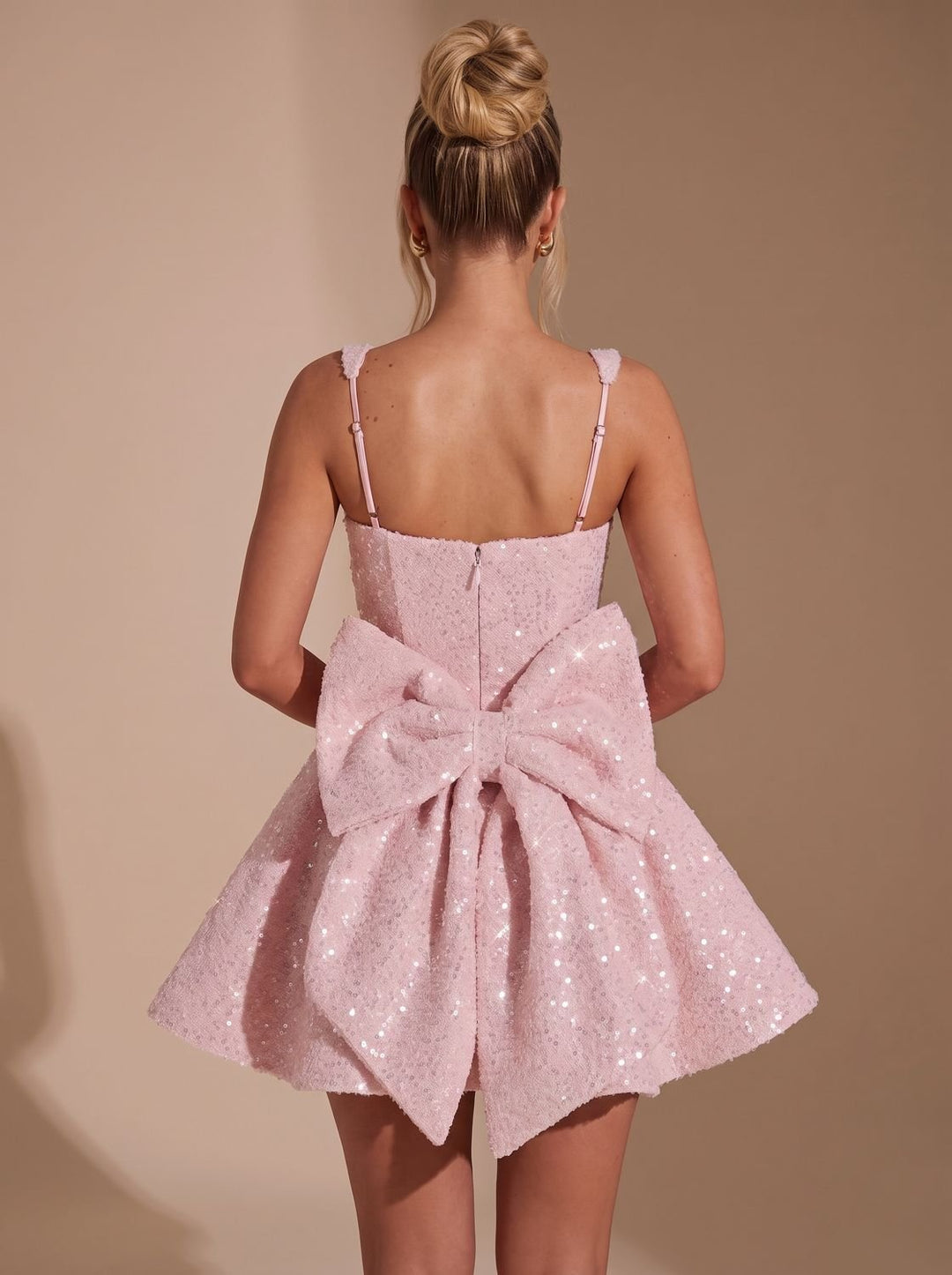 Harlowe sequin dress back view showing statement bow detail