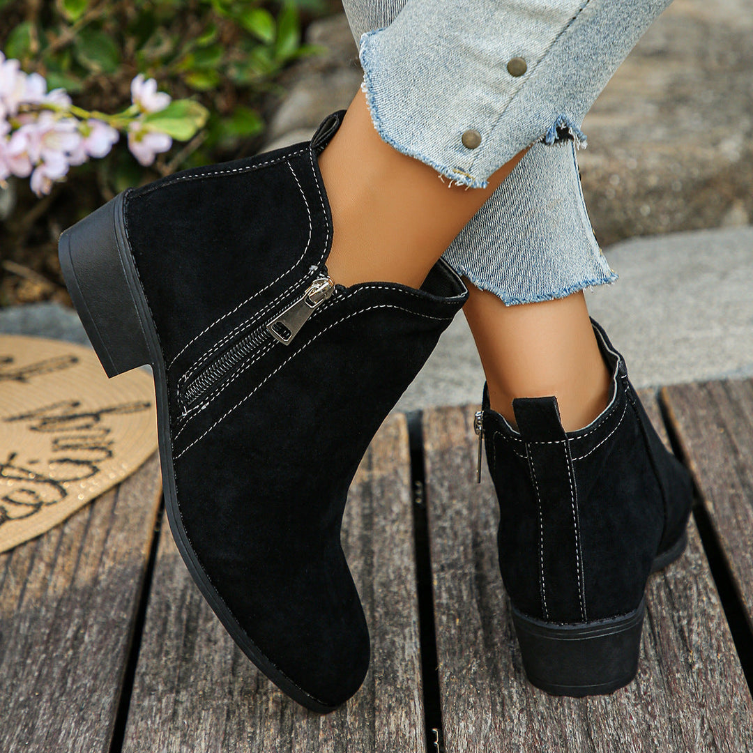 Esperanza black ankle boots, crossed ankle view showing zipper
