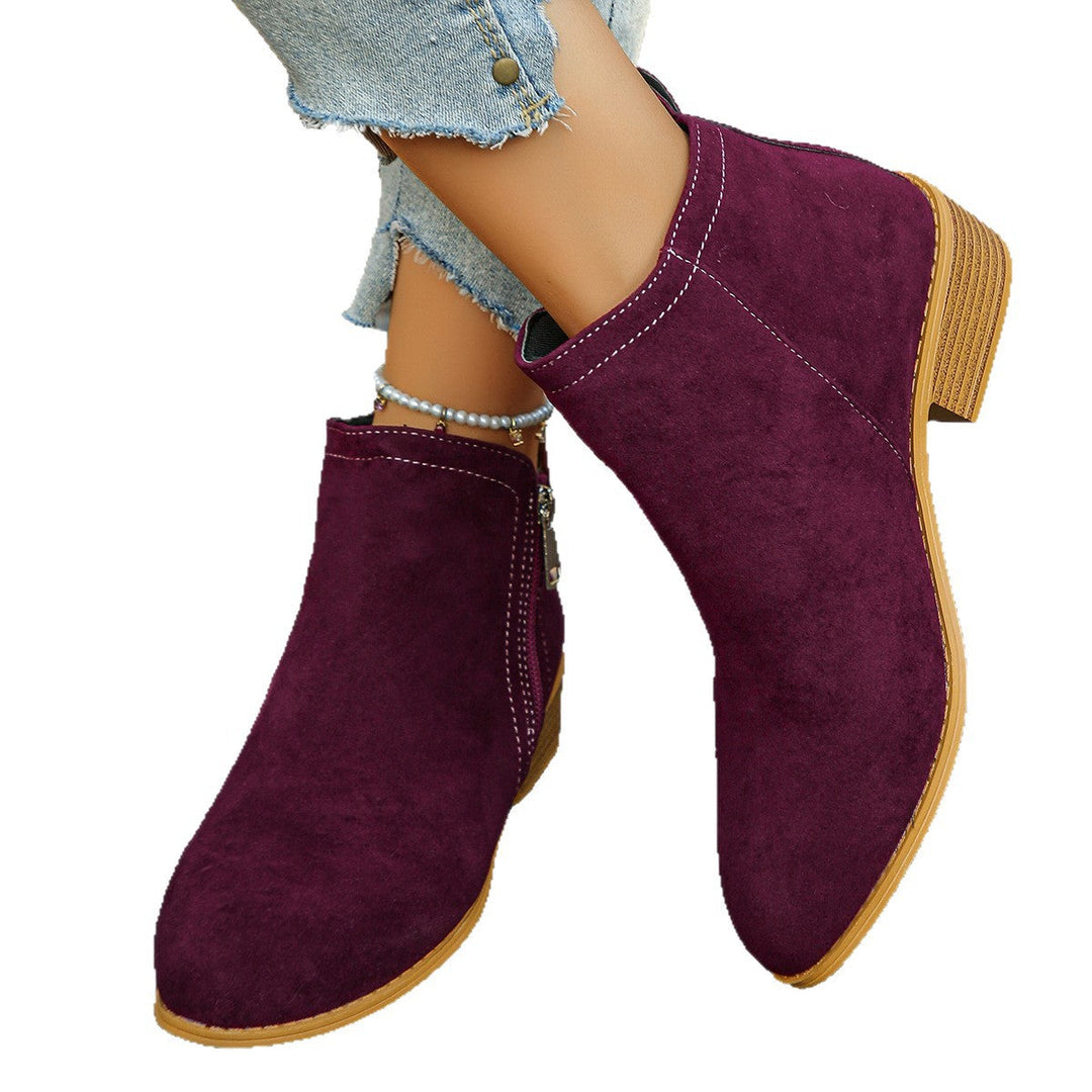 Esperanza black ankle boots, crossed ankle view showing zipper