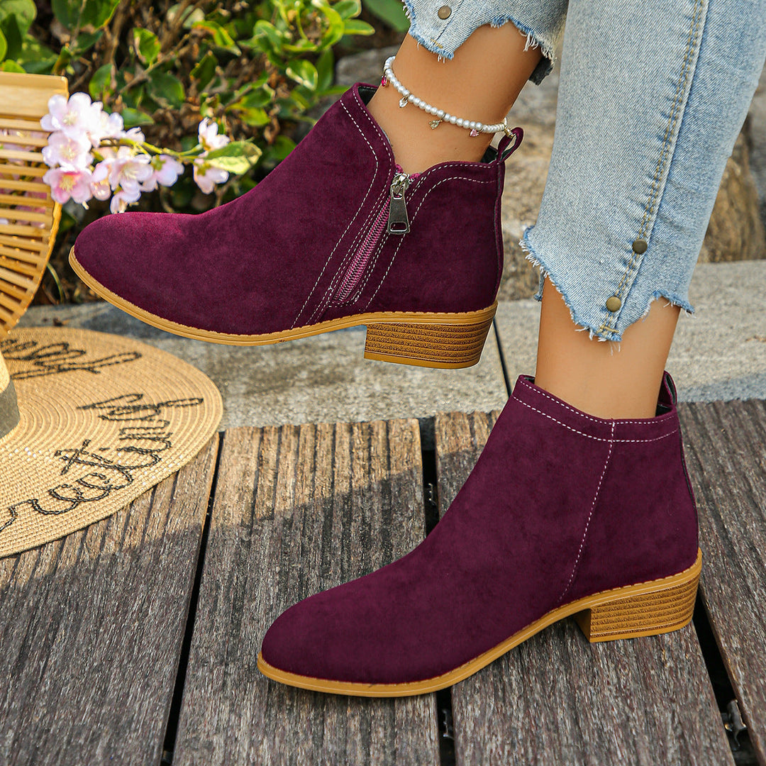 Esperanza black ankle boots, crossed ankle view showing zipper