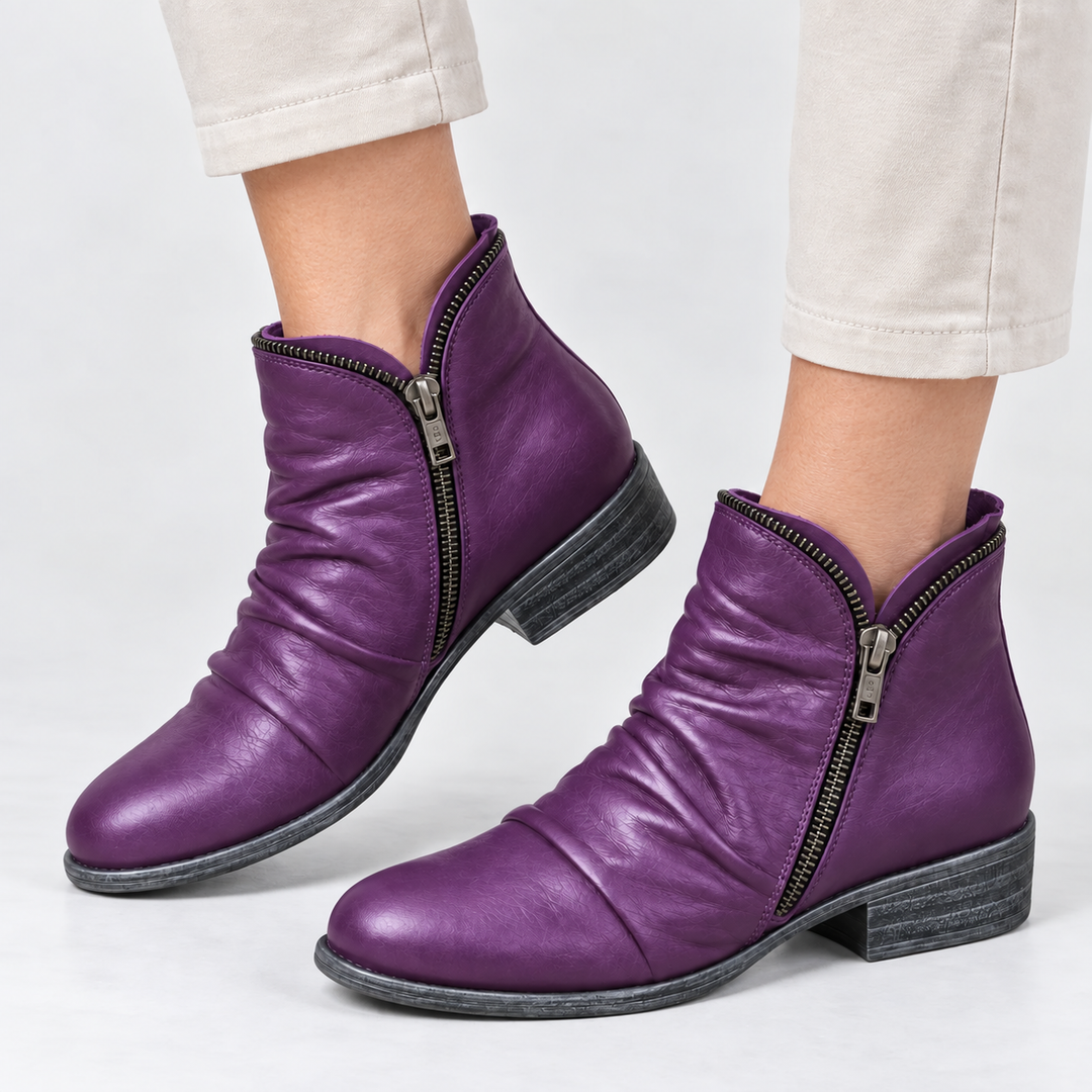 Vivienne purple slouch ankle boots, side profile on model