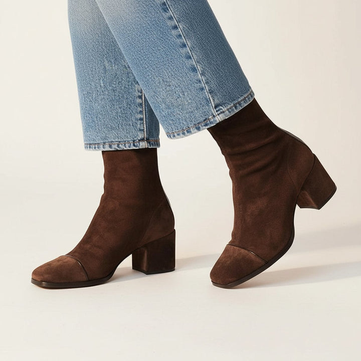 Delphine suede square-toe block-heel ankle boots, side profile walking view