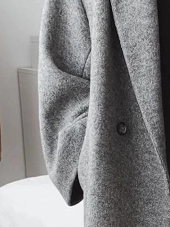 Close-up of Seraphine overcoat lapel and button detail