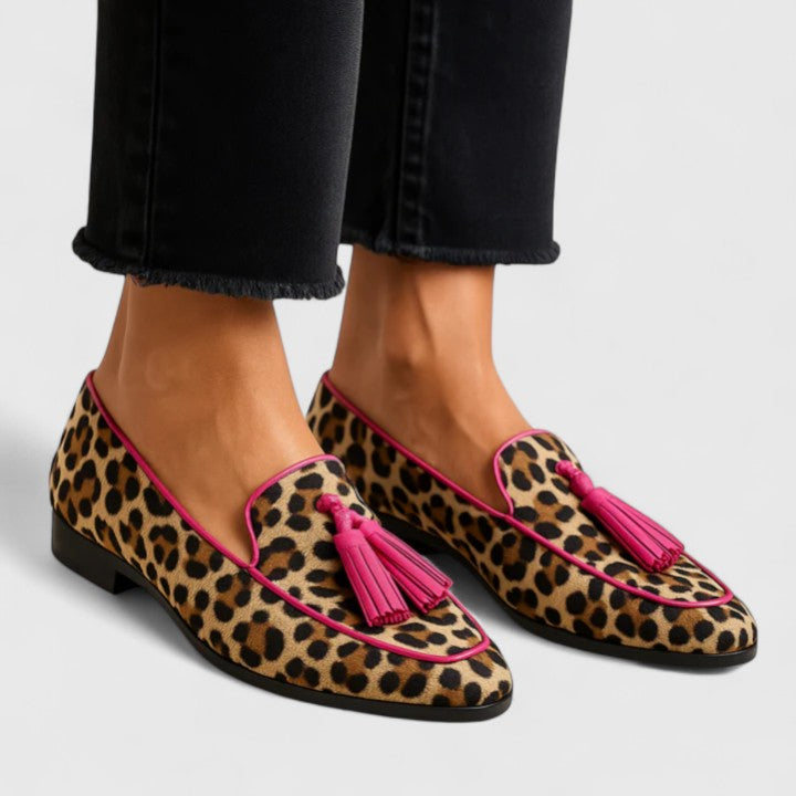 Estelle leopard print tasseled loafers on model, side view