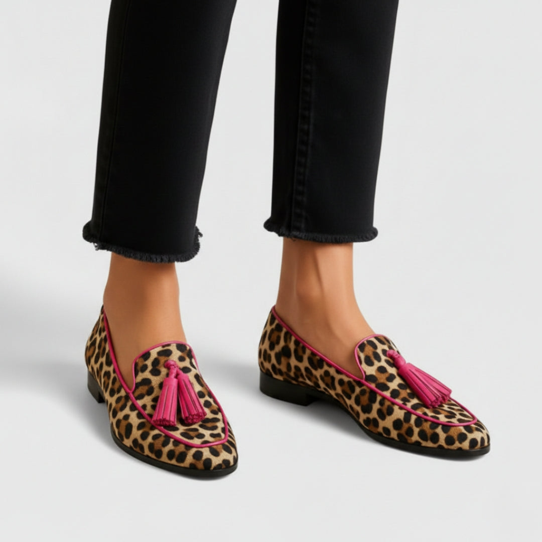 Estelle leopard print tasseled loafers on model, angled view