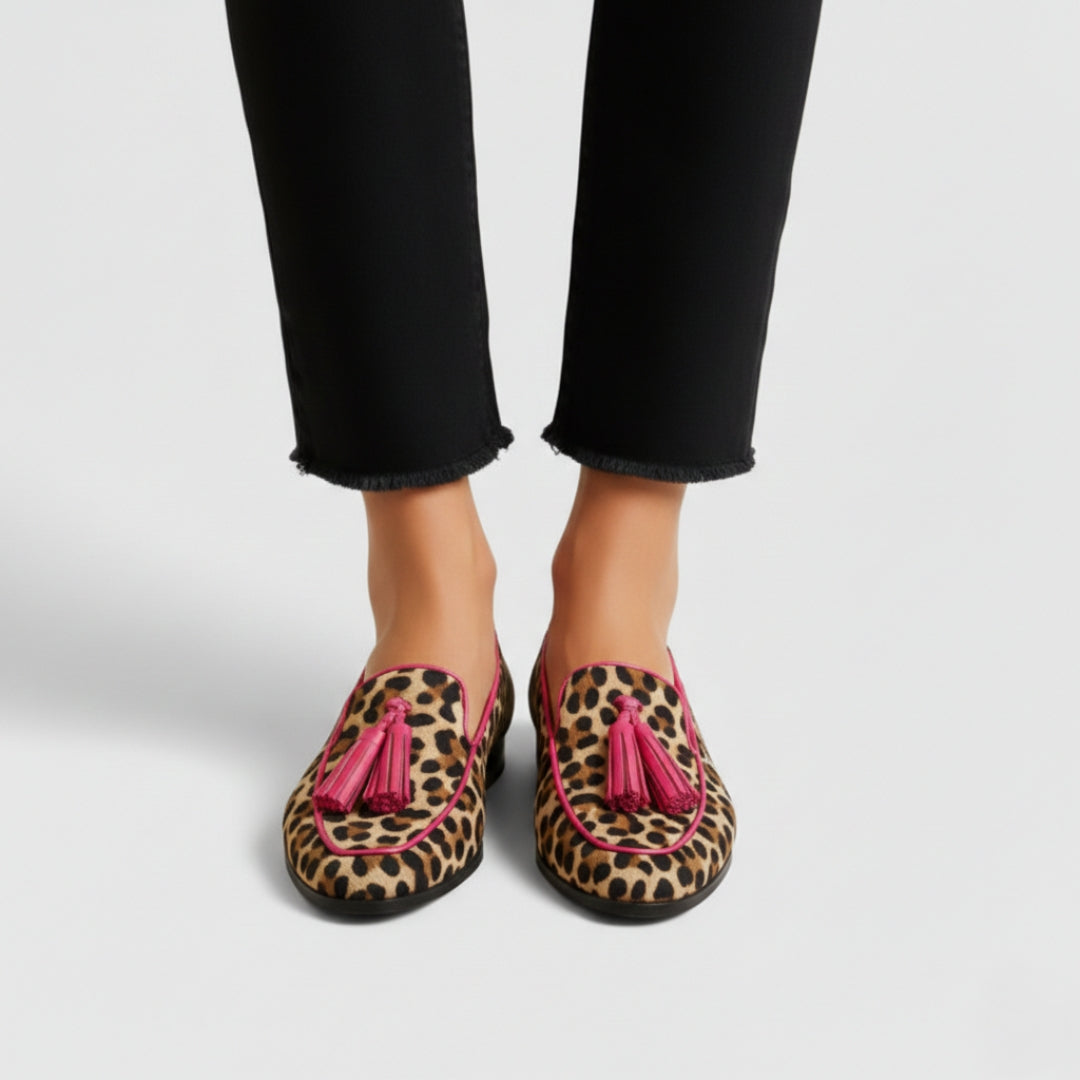 Estelle leopard print tasseled loafers on model, straight-on front view