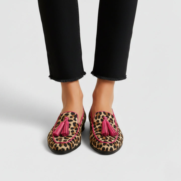 Estelle leopard print tasseled loafers on model, straight-on front view