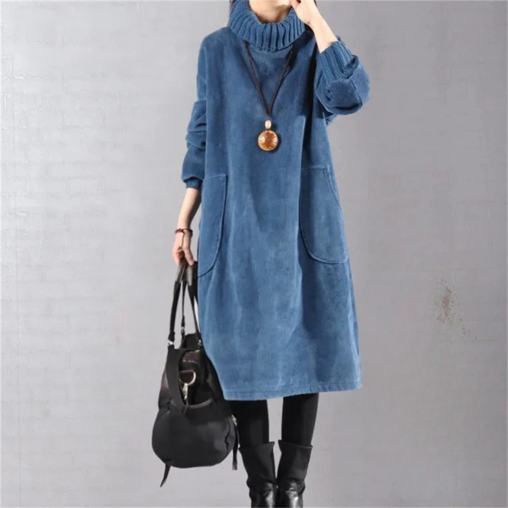 Marcelline turtleneck midi sweater dress in blue, front view with handbag