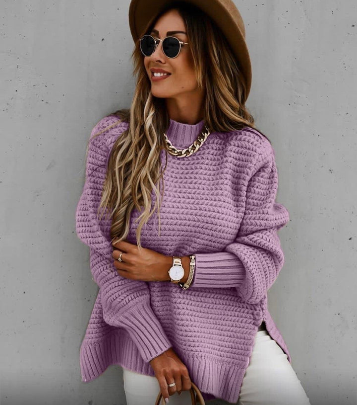 Delphine oversized turtleneck sweater in beige, front view with handbag