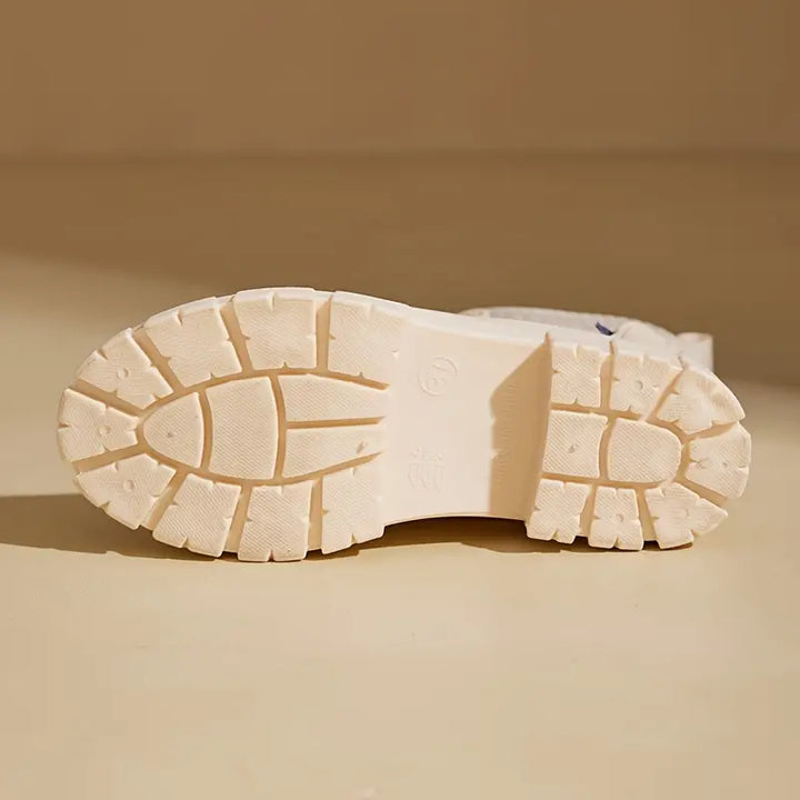 Bottom view of Marisol boot showing chunky lugged outsole tread