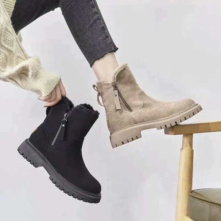 Winnifred black ankle boots worn with cropped pants, walking view