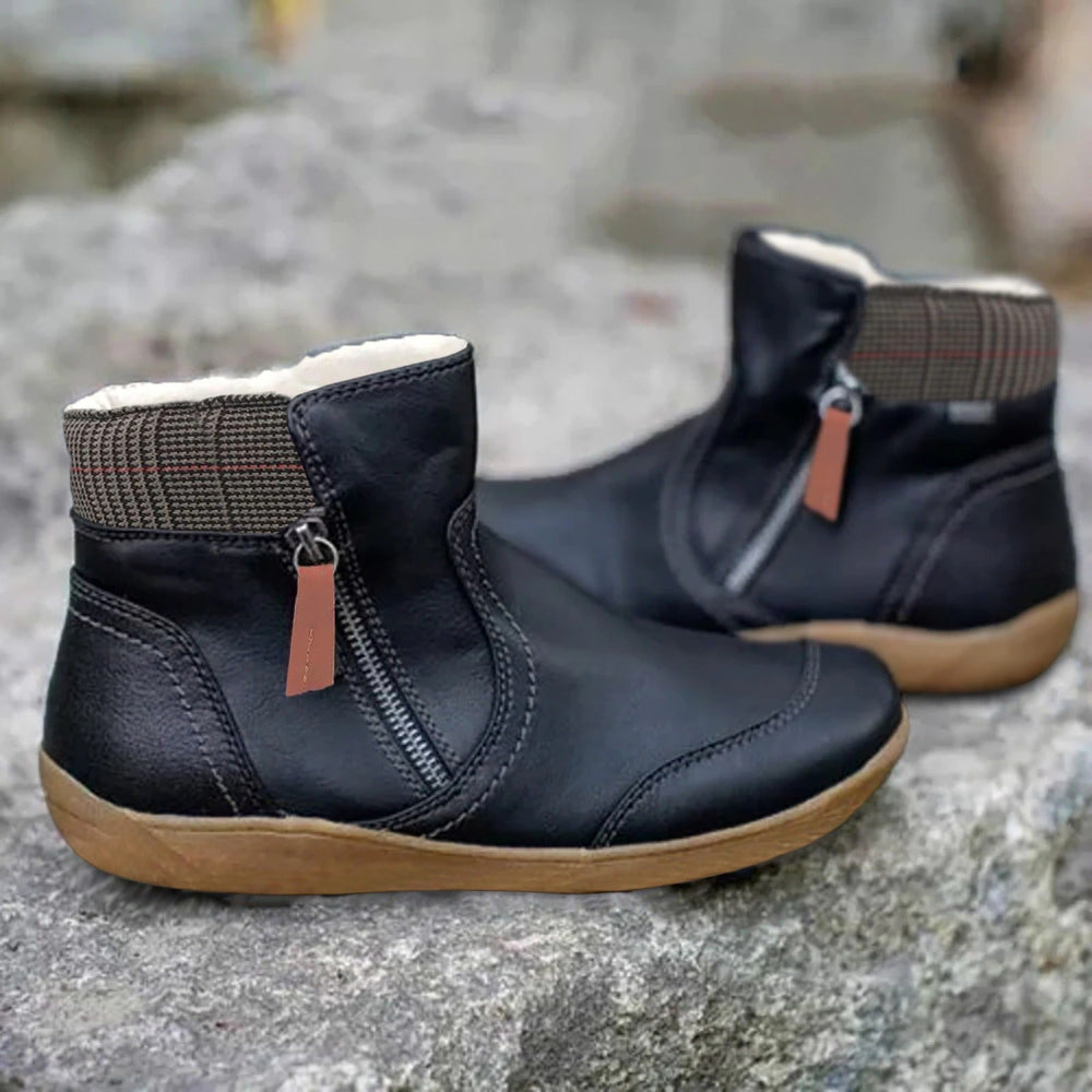 Linnea black zip-up ankle boots with woven cuff detail, side view