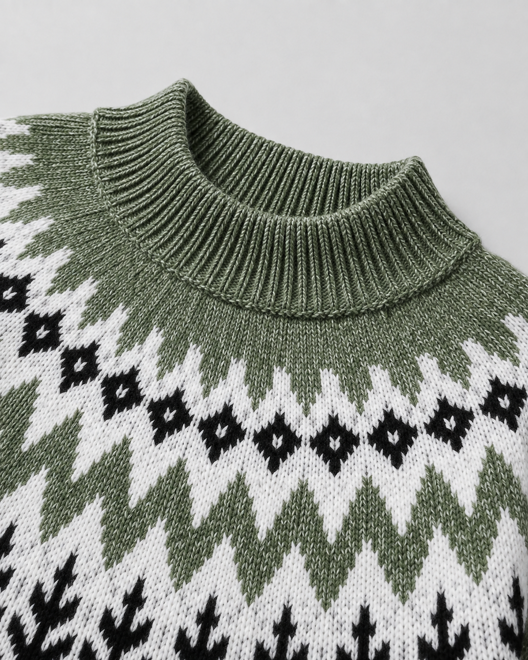 Wren Fair Isle mock neck sweater, close-up of ribbed hem and knit pattern