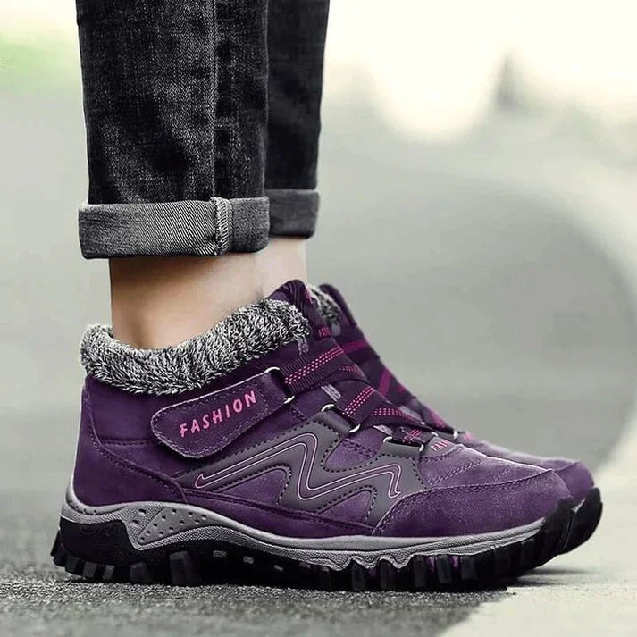 Wren fur trim winter ankle boots in purple, side view on model