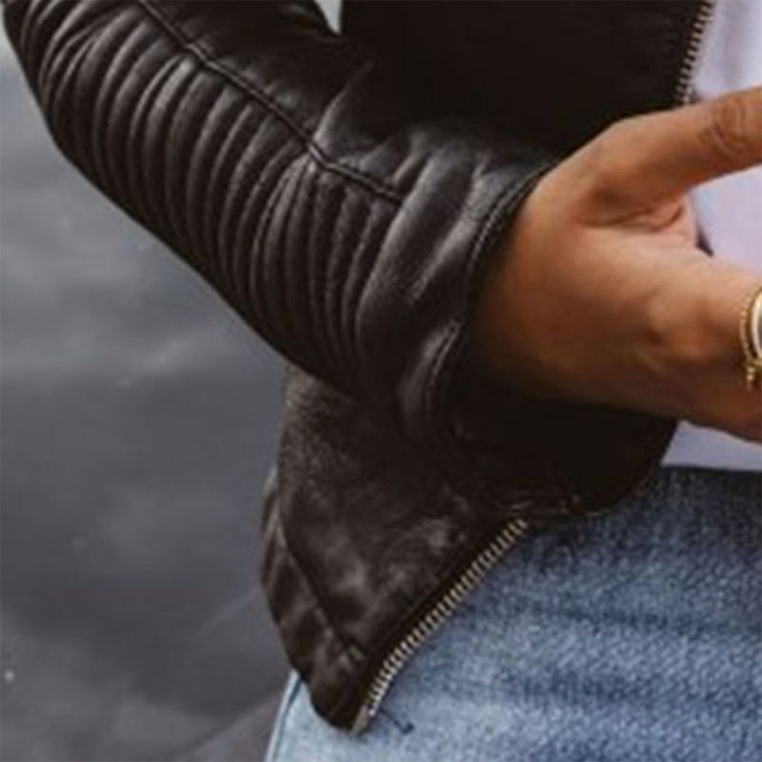 Close-up of Wren biker jacket ribbed sleeve and zip cuff detail