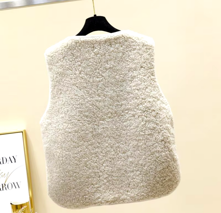 Wynnie sherpa fleece vest in cream, back view on hanger