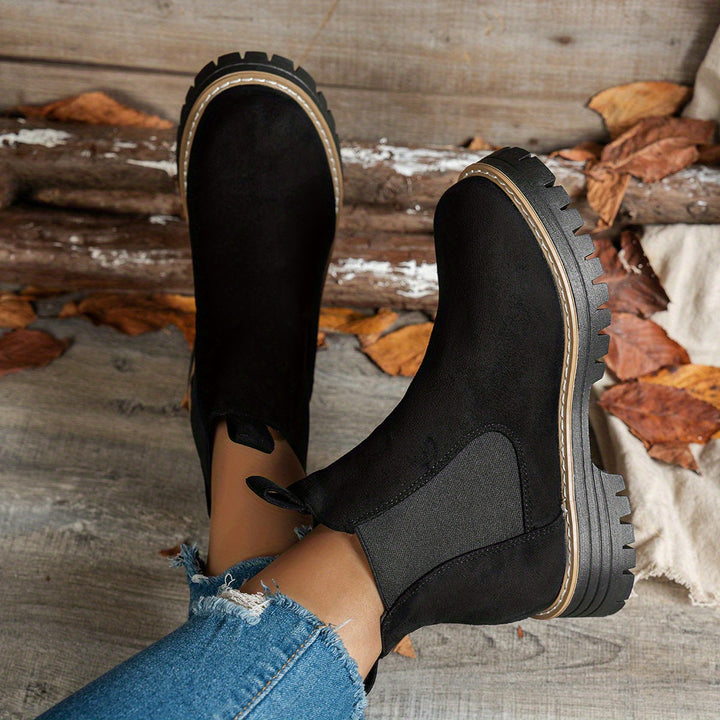 Wynter platform Chelsea boots in black, top and side view showing lug sole