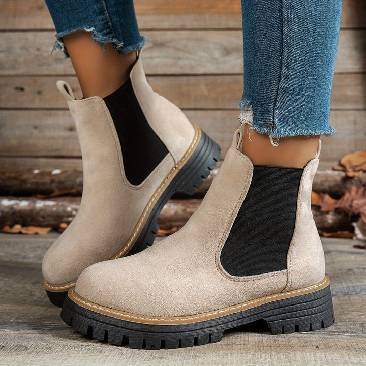 Wynter Chelsea boots in beige, side view on model