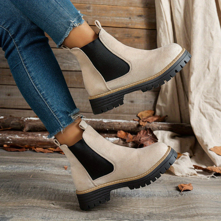 Wynter Chelsea boots in beige, side view close-up on model