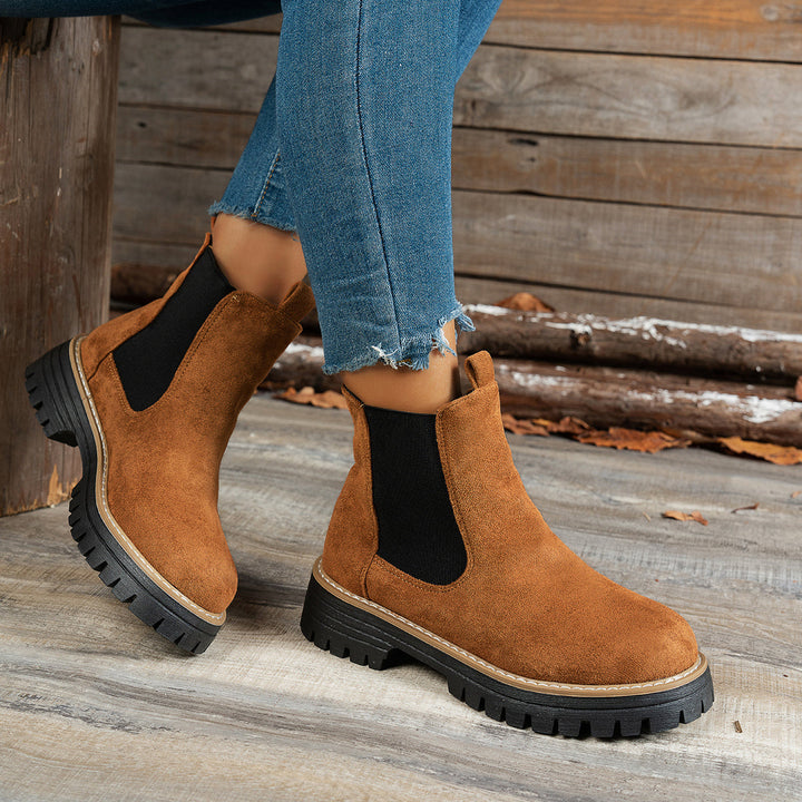 Wynter Chelsea boots in brown, side view close-up on model